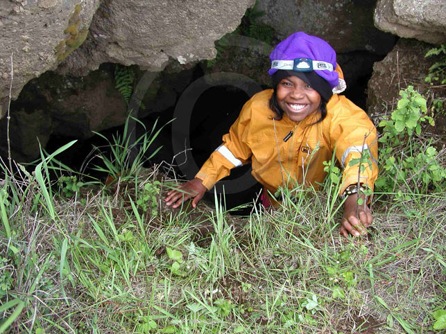 Peering out a cave entrance near Trout Lake, Washington